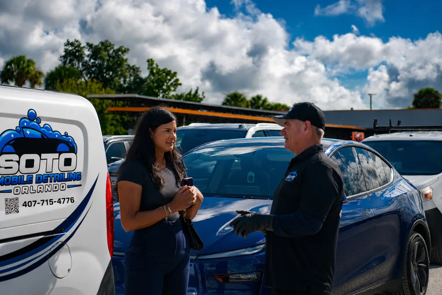 Mobile detailing company in Orlando, FL · reviews section Mobile detailing company in Orlando, FL · detailer walking a customer around the finished vehicle